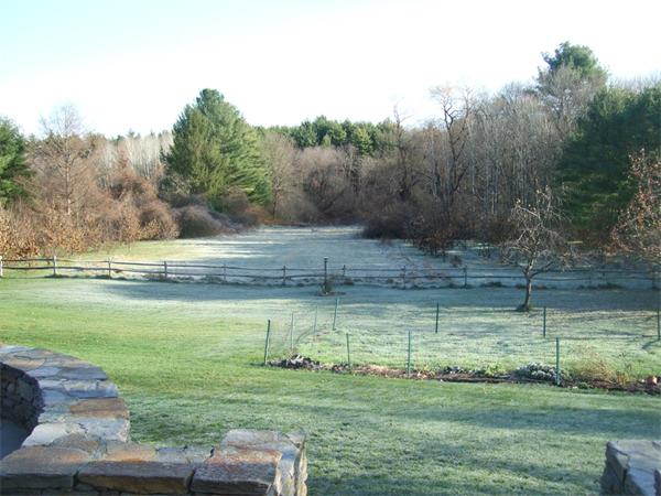 99 Concord Road Wayland, MA 01778 - Photo 5 of 12 a view of a lake with a yard