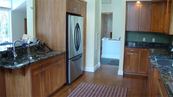 99 Concord Road Wayland, MA 01778 - Photo 7 of 12 a kitchen with refrigerator and cabinets