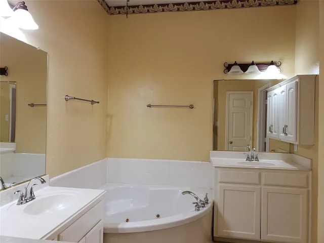 a bathroom with a bathtub and a sink