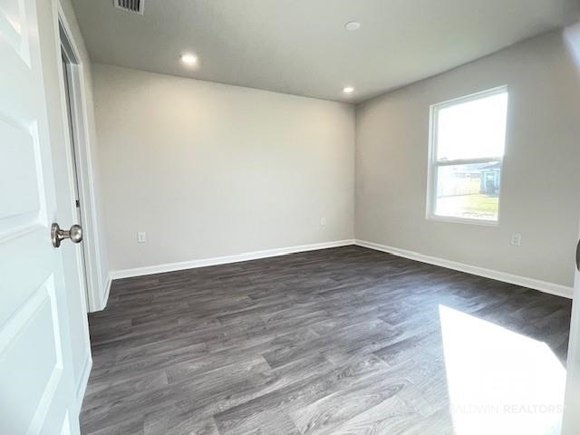 1024 South Bay Street Foley, AL 36535 - Photo 12 of 28 Unfurnished room featuring dark wood-type flooring