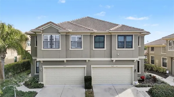 a front view of a house with a garage