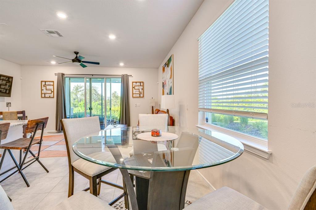 5443 Elmview Crossing Wesley Chapel, FL 33545 - Photo 12 of 41 a view of a dining room with furniture and window