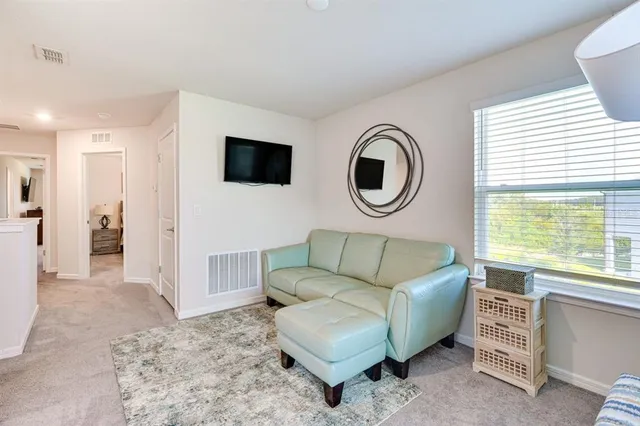 a white toilet sitting next to a bathroom sink and tub