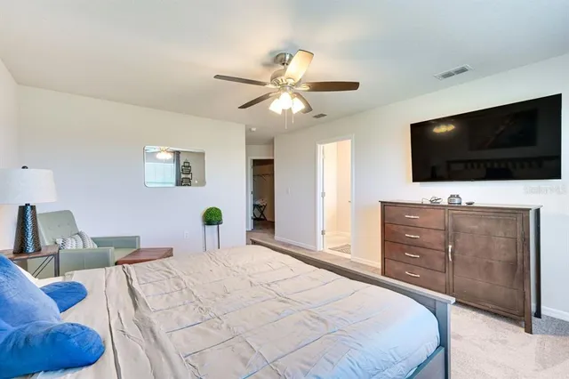 a living room with furniture a rug and a window
