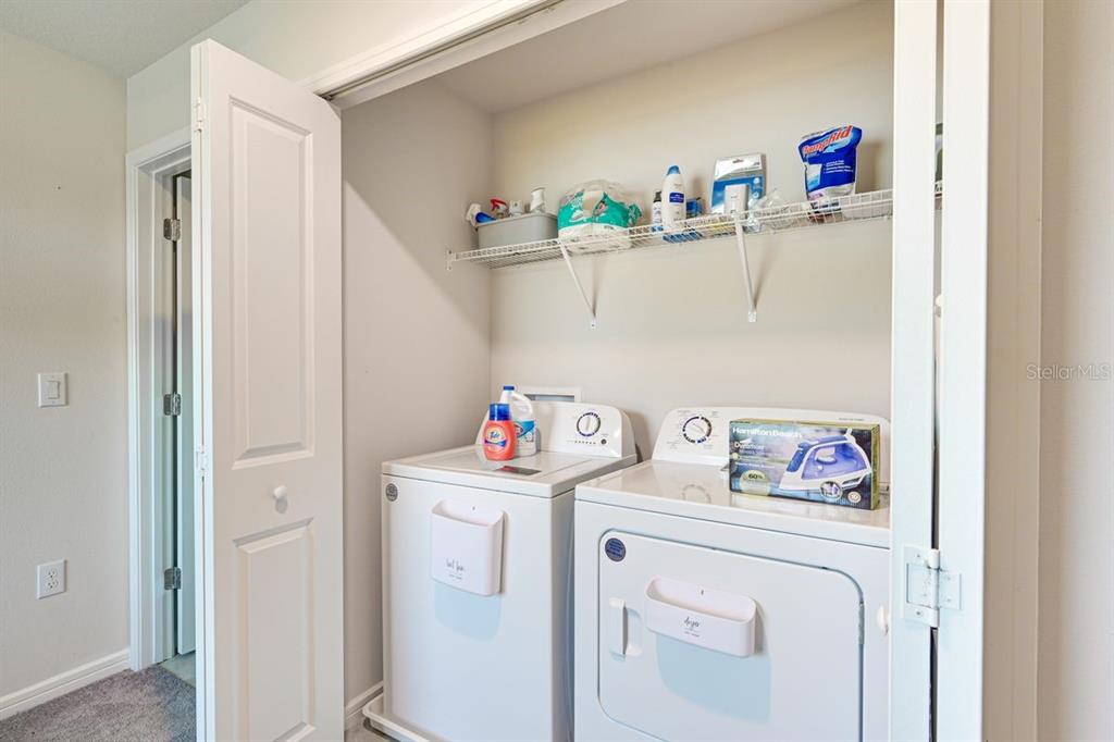 5443 Elmview Crossing Wesley Chapel, FL 33545 - Photo 26 of 41 a utility room with dryer and washer