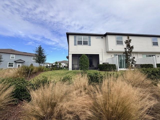 5443 Elmview Crossing Wesley Chapel, FL 33545 - Photo 35 of 41 a front view of a house with a yard