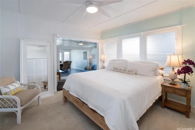 a bedroom with a bed and a chair