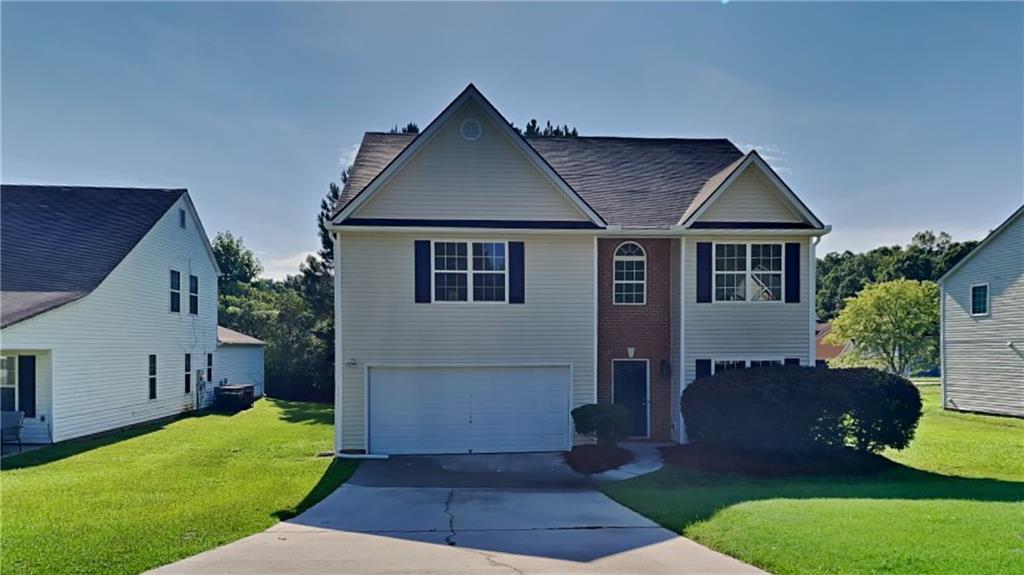8364 Milam Loop Fairburn, GA 30213 - Photo 1 of 1 a front view of a house with a yard
