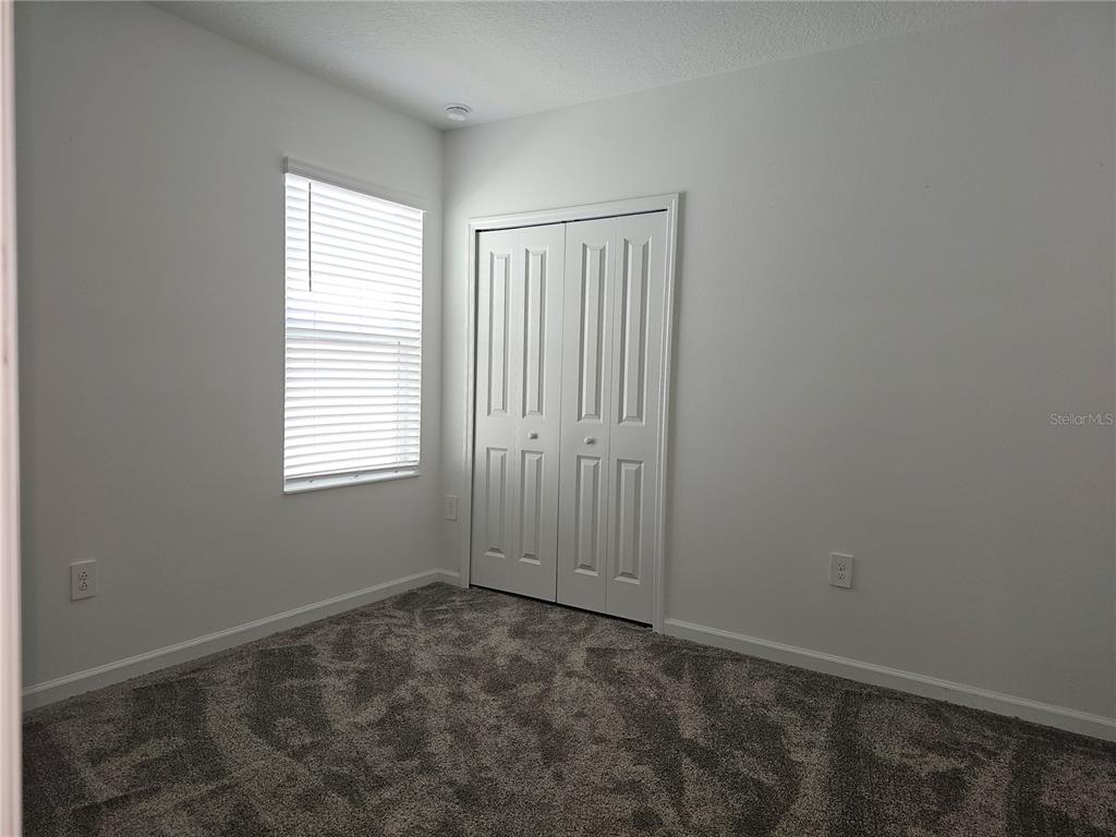 2629 Runners Circle Clermont, FL 34714 - Photo 13 of 22 an empty room with windows