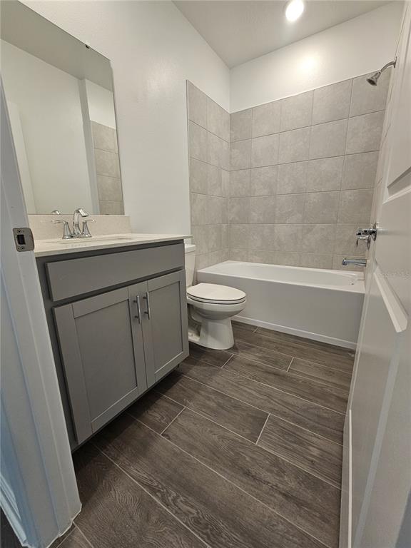 2629 Runners Circle Clermont, FL 34714 - Photo 14 of 22 a bathroom with a sink a toilet and shower