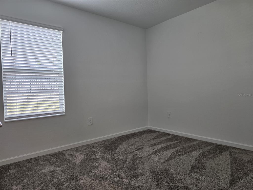 2629 Runners Circle Clermont, FL 34714 - Photo 15 of 22 a view of a room that has a window in it