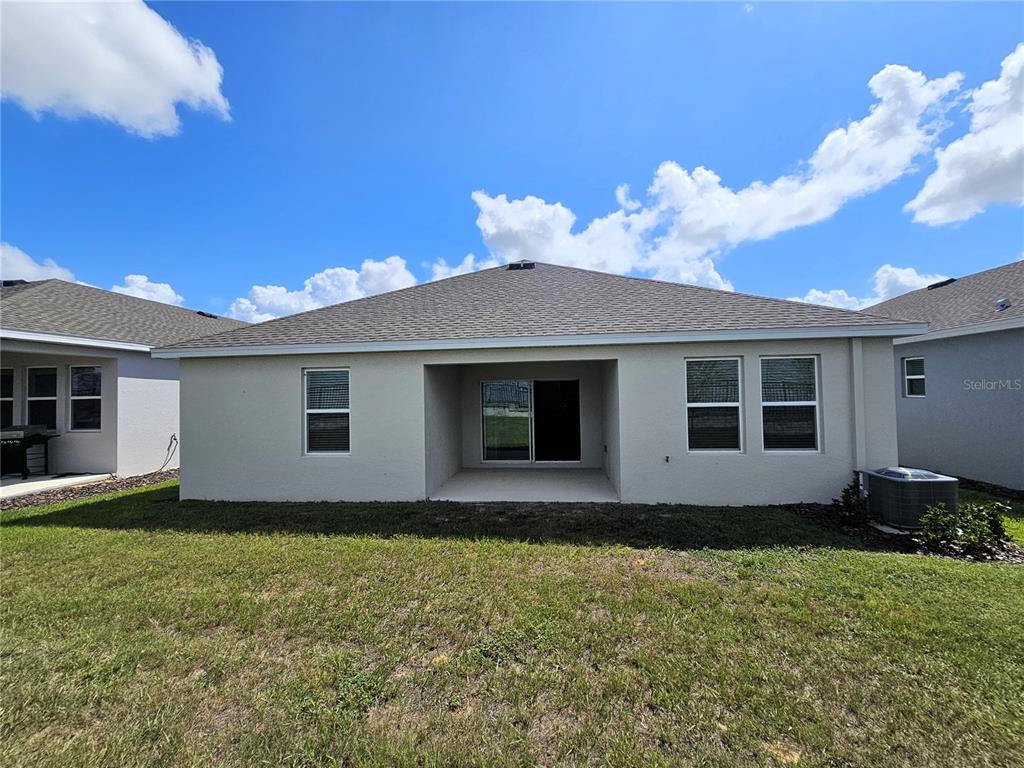 2629 Runners Circle Clermont, FL 34714 - Photo 17 of 22 a house with a yard