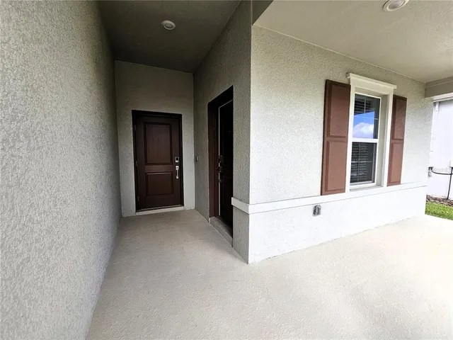 a view of an empty room with closet