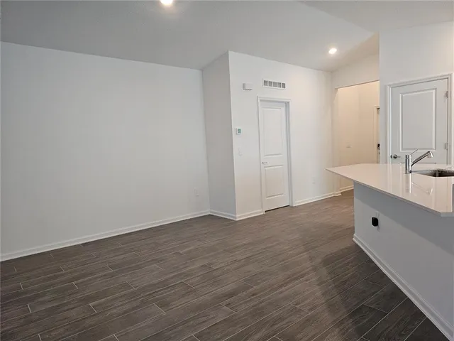 a view of a livingroom with wooden floor