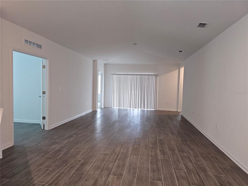 2629 Runners Circle Clermont, FL 34714 - Photo 8 of 22 a view of a livingroom with wooden floor