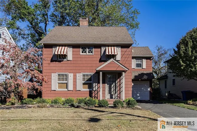 front view of a house with a small yard