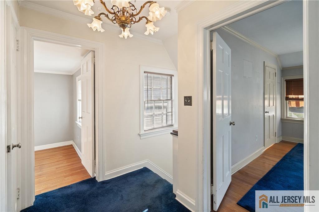311 Ashland Road Middlesex, NJ 08846 - Photo 14 of 23 a view of a hallway with wooden floor and staircase