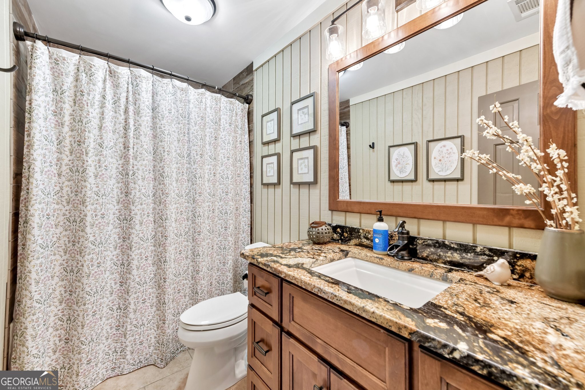 2630 Cold Springs Road Greensboro, GA 30642 - Photo 18 of 28 a bathroom with a granite countertop sink and a mirror