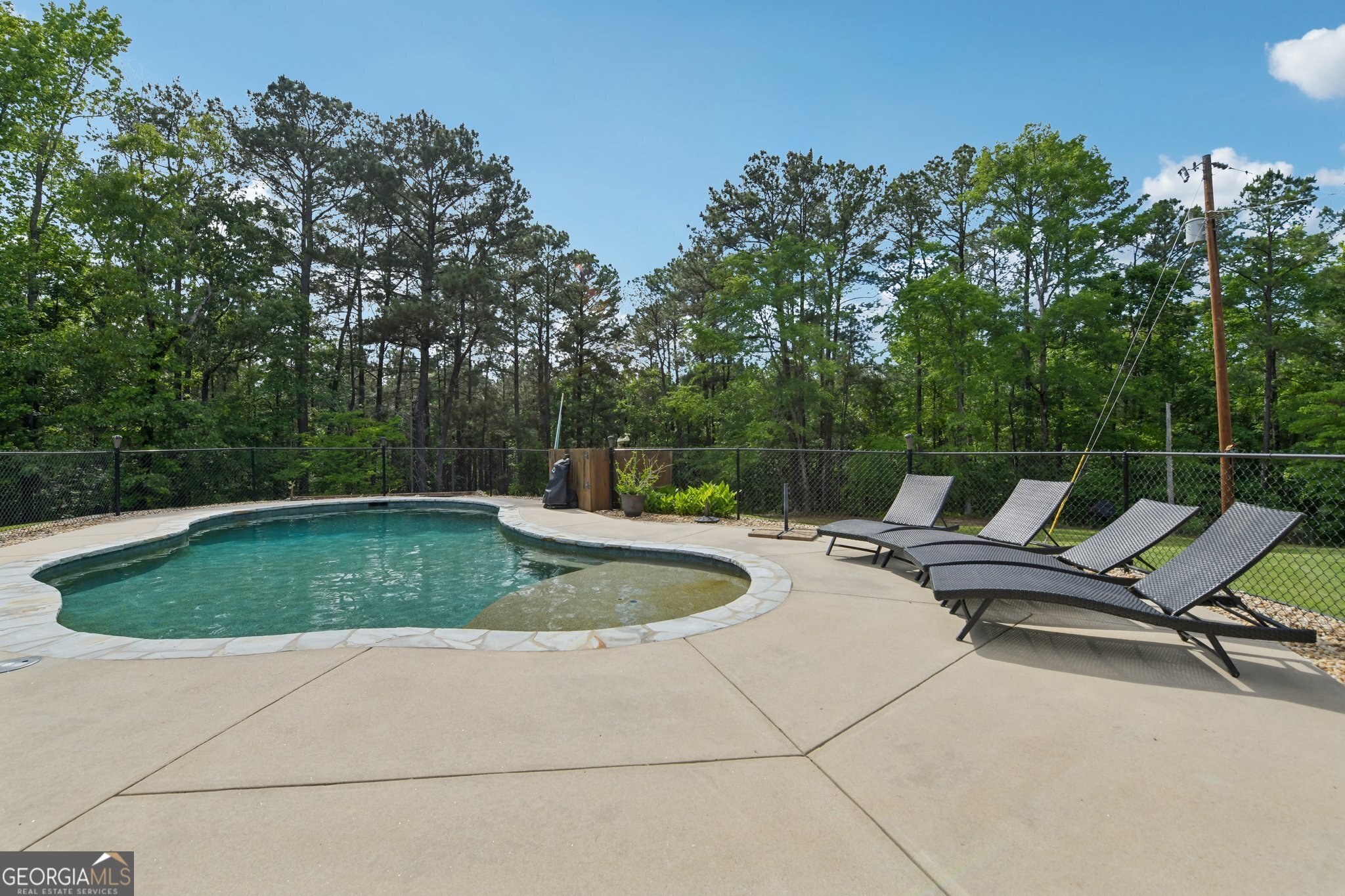 2630 Cold Springs Road Greensboro, GA 30642 - Photo 24 of 28 a view of backyard with a chair and trees