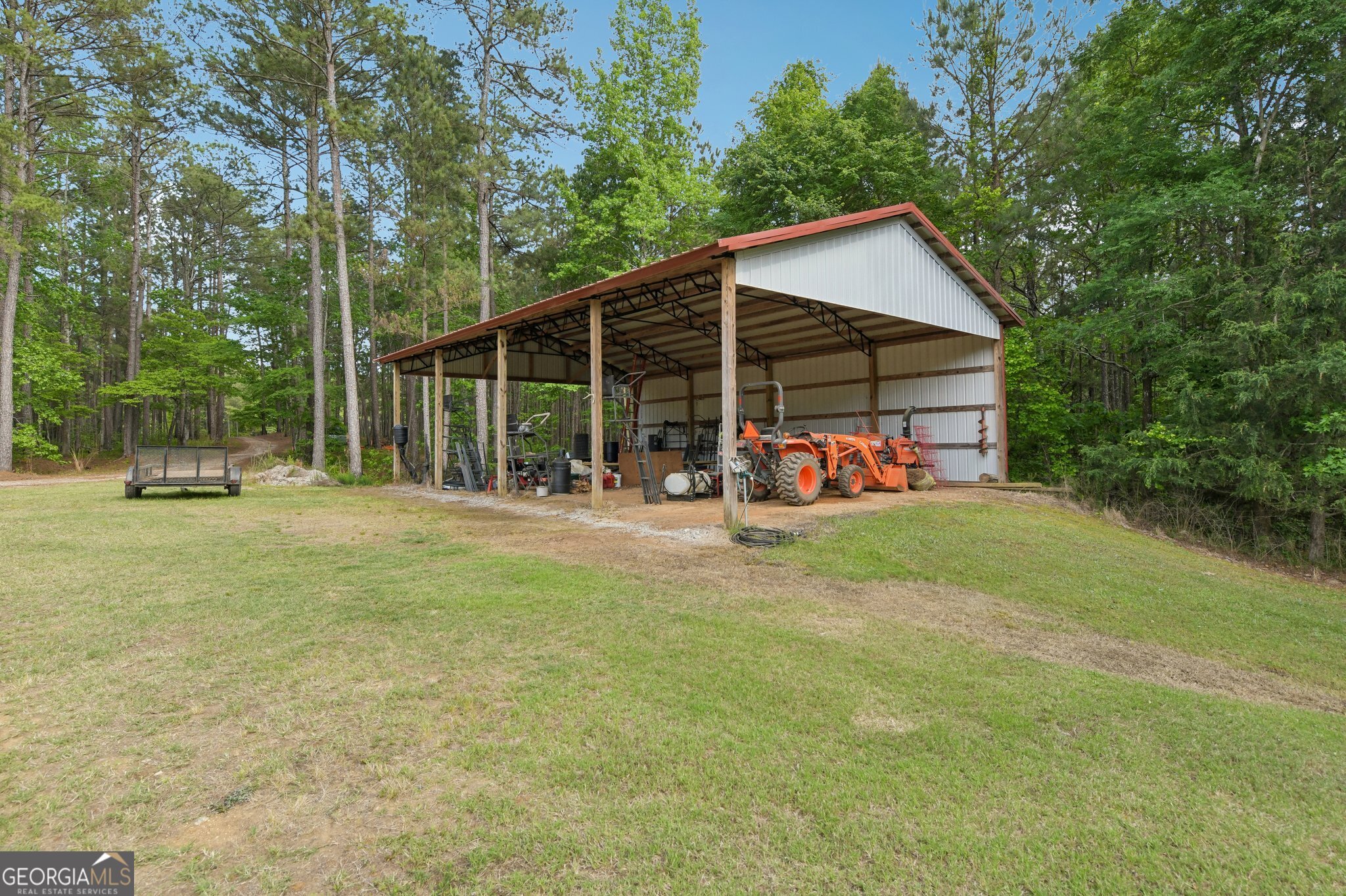 2630 Cold Springs Road Greensboro, GA 30642 - Photo 26 of 28 a backyard of a house with yard and outdoor seating