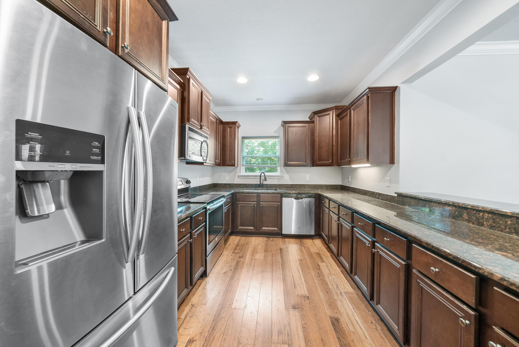 41 West Shore Place Inlet Beach, FL 32461 - Photo 12 of 31 a kitchen with a refrigerator sink and wooden floor