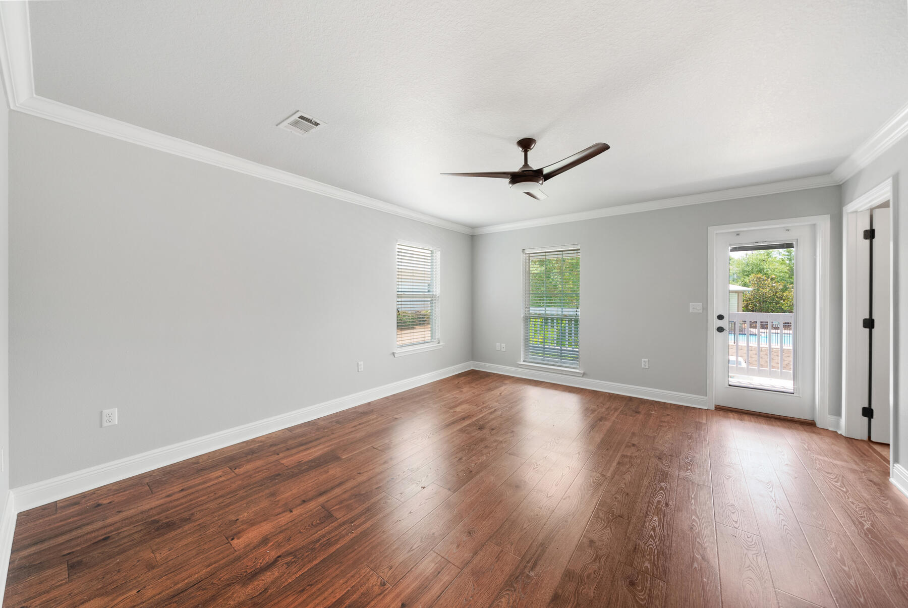 41 West Shore Place Inlet Beach, FL 32461 - Photo 19 of 31 a view of an empty room with wooden floor and a window
