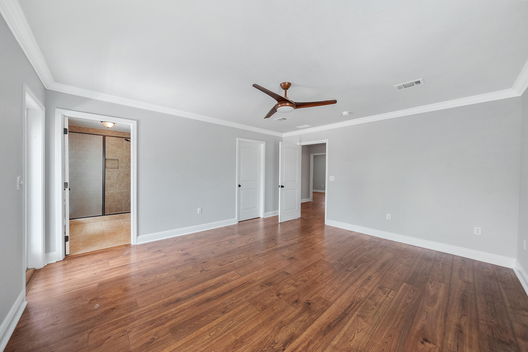 41 West Shore Place Inlet Beach, FL 32461 - Photo 21 of 31 a view of a livingroom with wooden floor and a ceiling fan