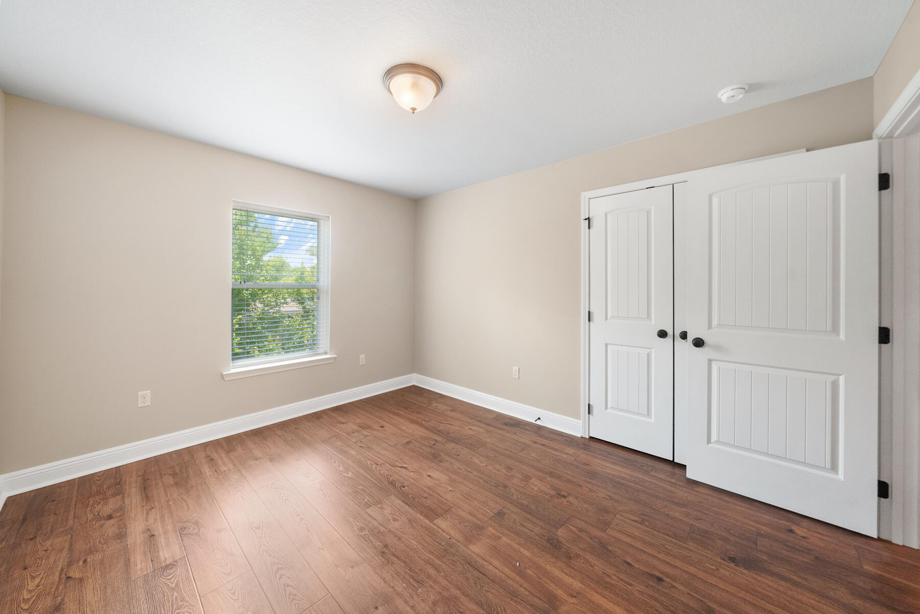 41 West Shore Place Inlet Beach, FL 32461 - Photo 24 of 31 an empty room with wooden floor and windows