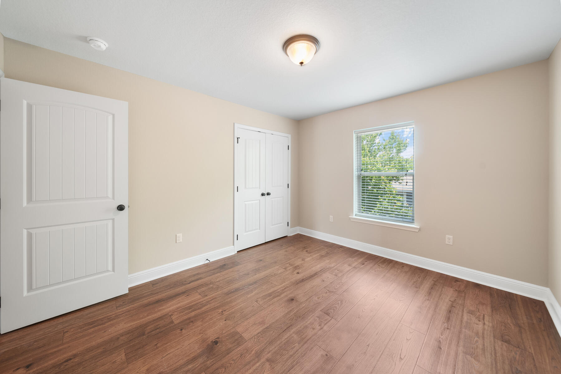 41 West Shore Place Inlet Beach, FL 32461 - Photo 26 of 31 an empty room with wooden floor and windows