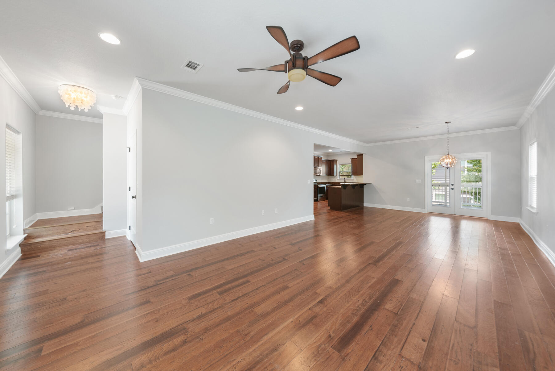 41 West Shore Place Inlet Beach, FL 32461 - Photo 7 of 31 an empty room with wooden floor and windows
