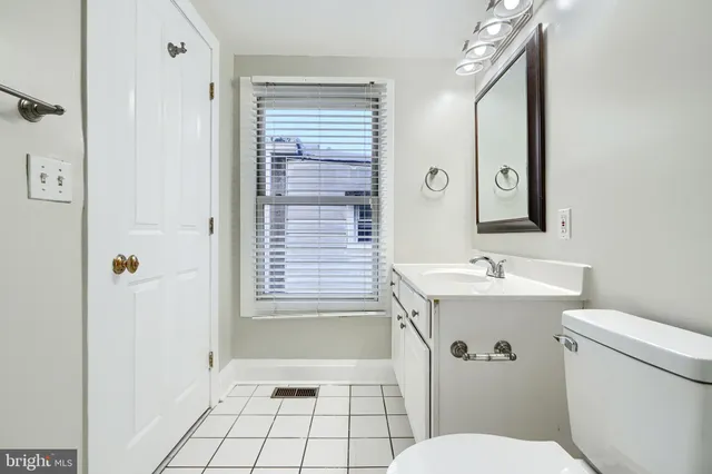 a bathroom with a toilet a sink and bathtub