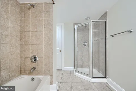 a bathroom with a toilet sink and shower