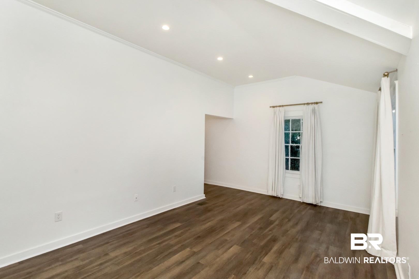 16 Princess Anne Road Mobile, AL 36608 - Photo 21 of 40 Unfurnished room featuring dark wood-style flooring, recessed lighting, and lofted ceiling