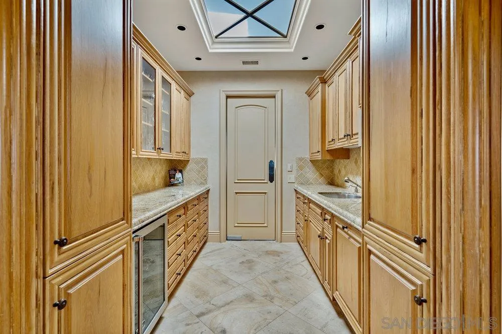 7756 St Andrews Road Rancho Santa Fe, CA 92067 - Photo 19 of 68 a bathroom with a sink and a window