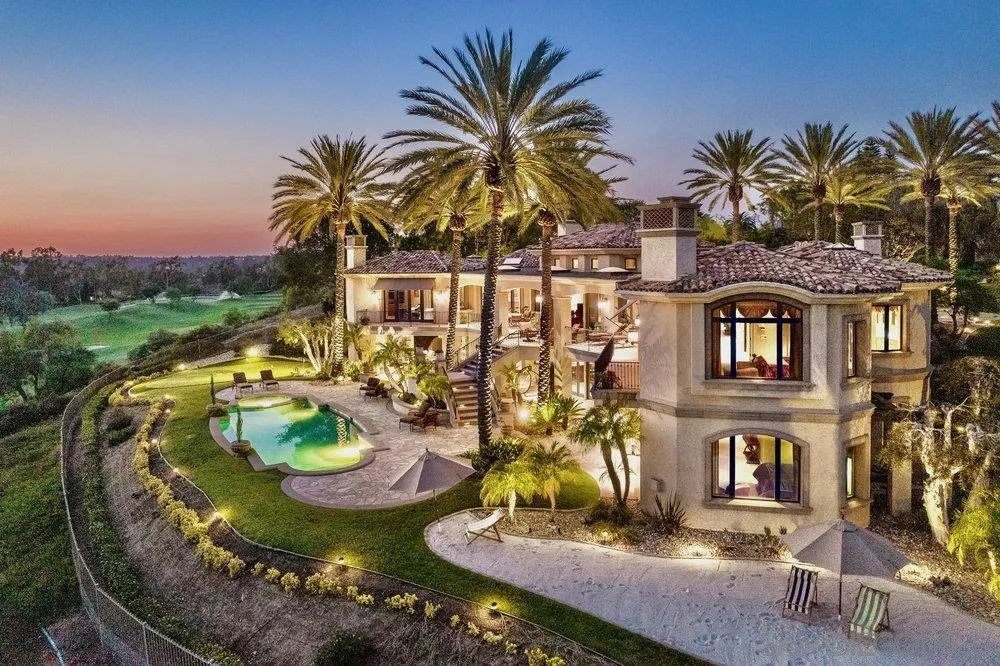 7756 St Andrews Road Rancho Santa Fe, CA 92067 - Photo 2 of 68 a view of a swimming pool with a garden and plants