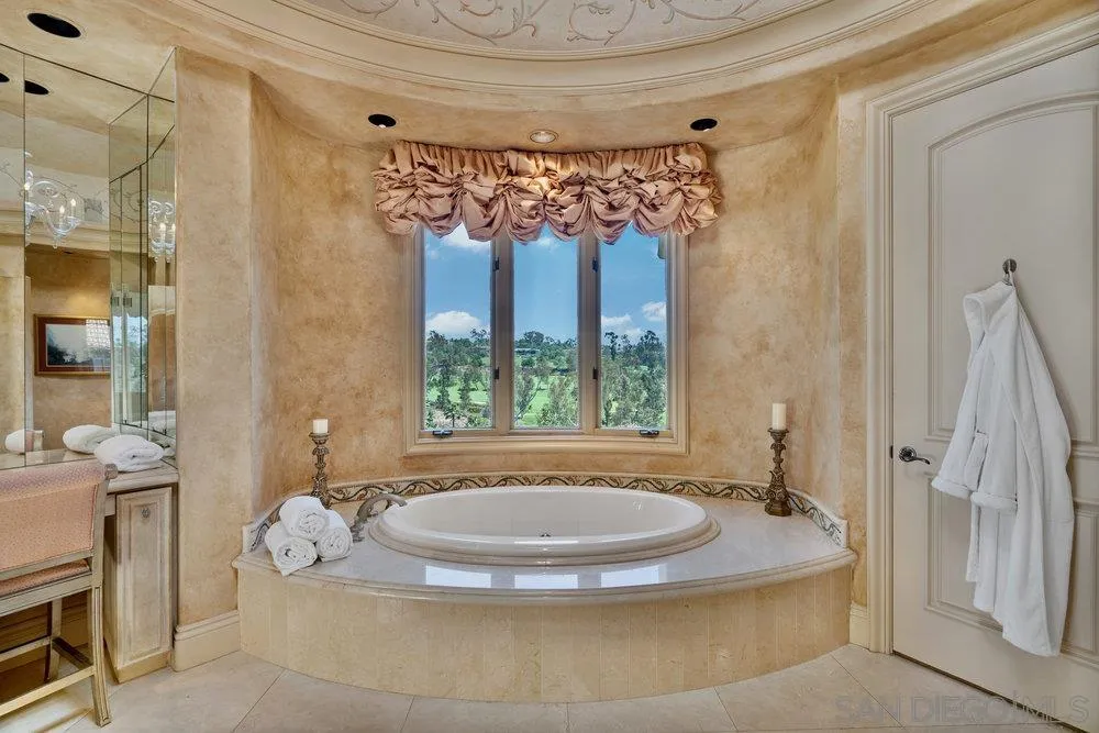 7756 St Andrews Road Rancho Santa Fe, CA 92067 - Photo 26 of 68 a view of a bathroom with tub and window