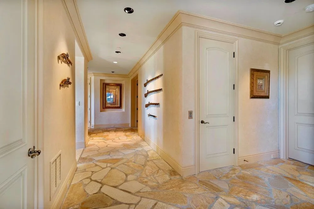 7756 St Andrews Road Rancho Santa Fe, CA 92067 - Photo 28 of 68 a view of a hallway with wooden floor and closet area
