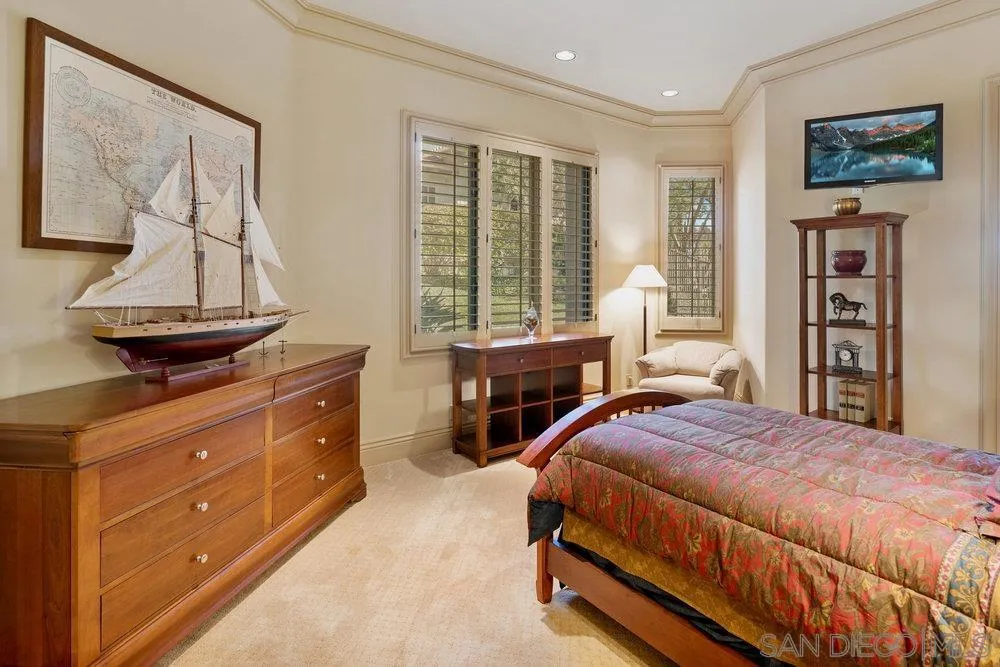 7756 St Andrews Road Rancho Santa Fe, CA 92067 - Photo 32 of 68 a bedroom with a bed and wooden floor