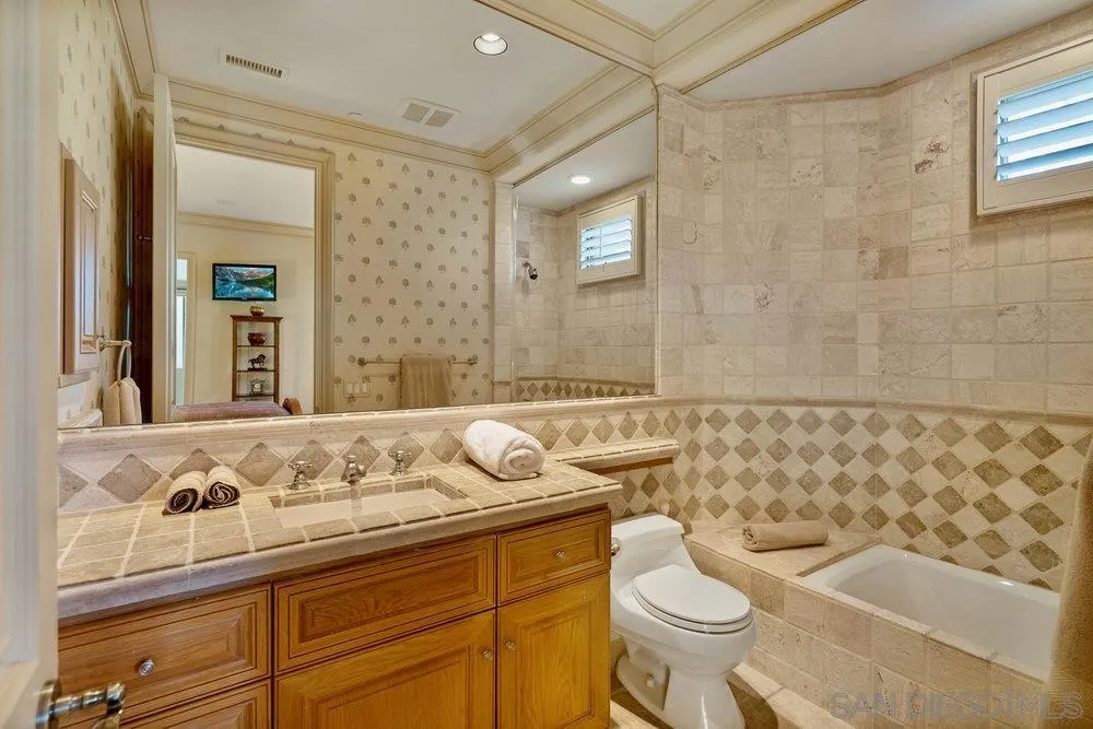 7756 St Andrews Road Rancho Santa Fe, CA 92067 - Photo 33 of 68 a bathroom with a sink and a toilet