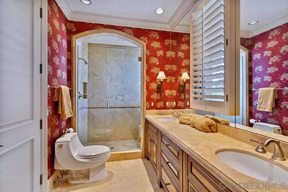 7756 St Andrews Road Rancho Santa Fe, CA 92067 - Photo 37 of 68 a bathroom with a sink a toilet and shower