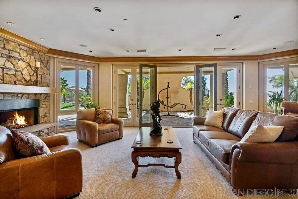 7756 St Andrews Road Rancho Santa Fe, CA 92067 - Photo 39 of 68 a living room with furniture and a large window