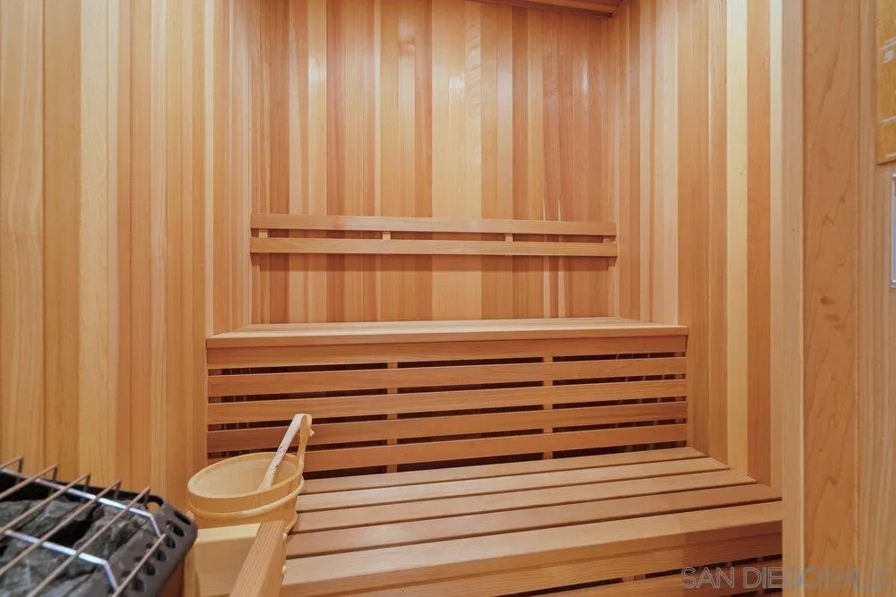 7756 St Andrews Road Rancho Santa Fe, CA 92067 - Photo 45 of 68 a bathroom with a toilet and a shower curtain