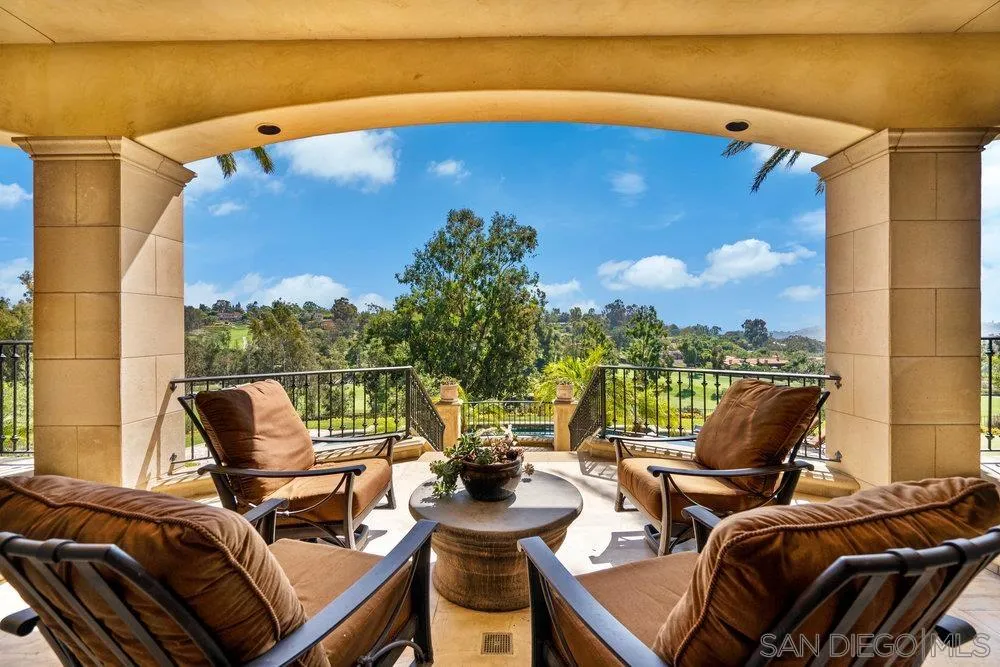 7756 St Andrews Road Rancho Santa Fe, CA 92067 - Photo 50 of 68 a view of a balcony with chairs and a potted plant