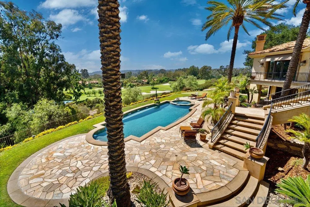 7756 St Andrews Road Rancho Santa Fe, CA 92067 - Photo 52 of 68 a view of a swimming pool with a yard