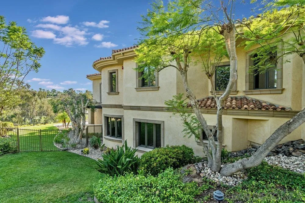 7756 St Andrews Road Rancho Santa Fe, CA 92067 - Photo 61 of 68 a front view of a house with garden