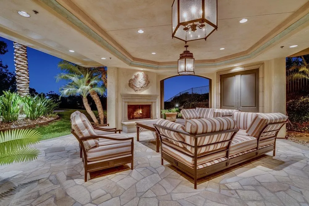 7756 St Andrews Road Rancho Santa Fe, CA 92067 - Photo 64 of 68 a bedroom with furniture and a chandelier