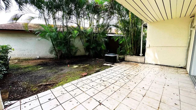 a view of a backyard of the house