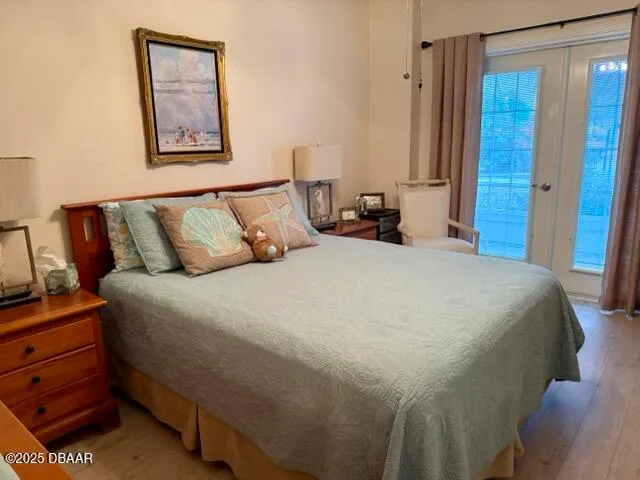 a bedroom with a bed and a mirror