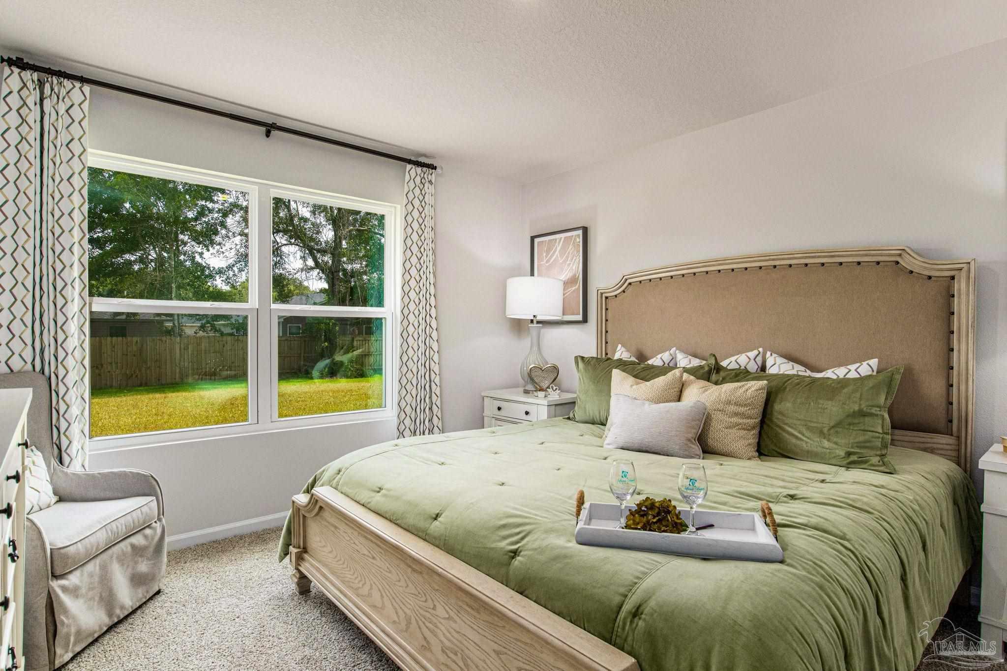 4413 White Birch Court Pace, FL 32571 - Photo 14 of 21 a bedroom with a bed and a large window