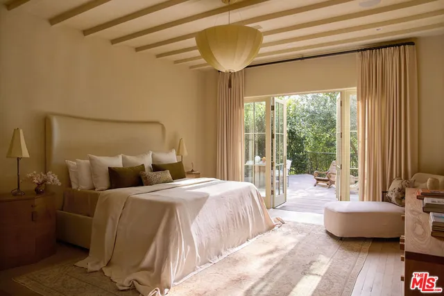 a bedroom with a bed and a couch